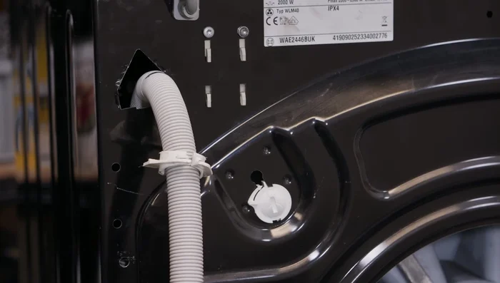 Remove the old drain hose.