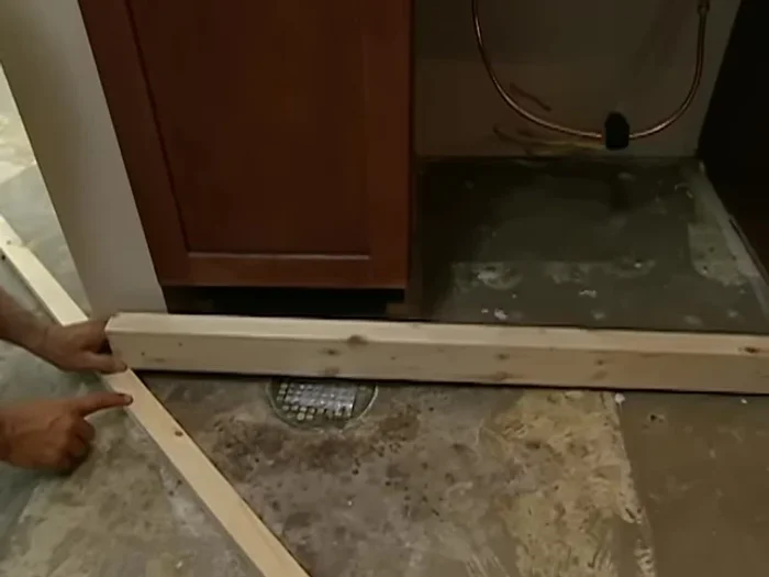 Install subsequent rails: Place the next rail, resting it on the first rail. Check for level using a level and shims as needed. Use the same scribing method as before to match the thickness of existing rails.