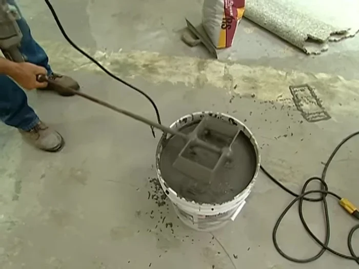 Level the compound: Use a screed to level the compound, ensuring it is even with the top of the rails.