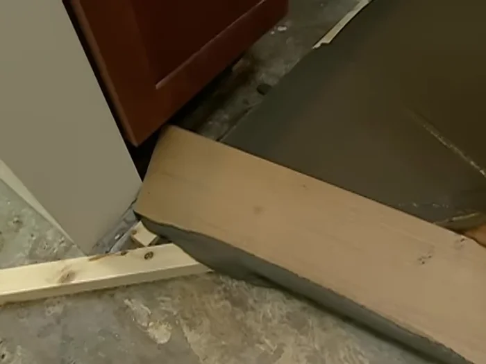 Level the compound: Use a screed to level the compound, ensuring it is even with the top of the rails.