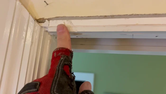 Remove the old door.