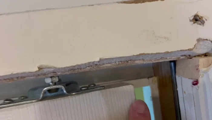 Remove the old door.