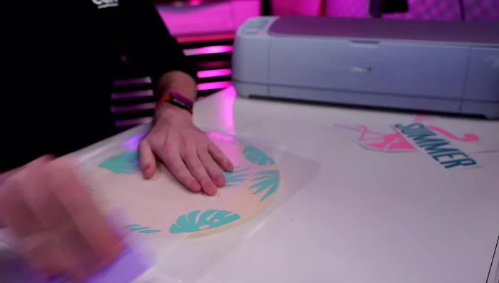 Apply the vinyl design to your painted and sealed wood round.