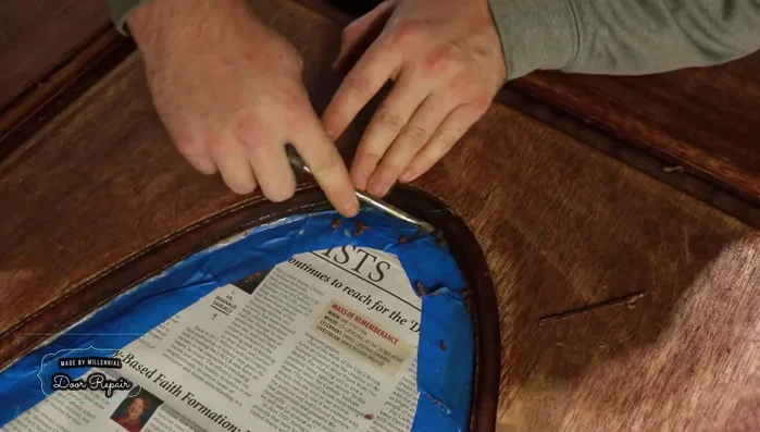 Fill gouges with wood filler, ensuring it's pushed deep into the gouge for a strong bond.