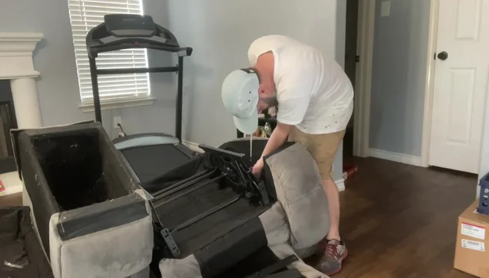 Secure the mechanism to the center console with wood screws.