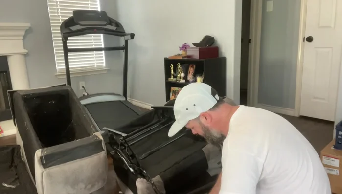 Secure the mechanism to the center console with wood screws.