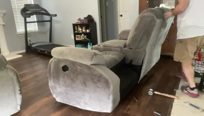 Remove screws (typically 3-4 Phillips head screws on each side) securing the mechanism.