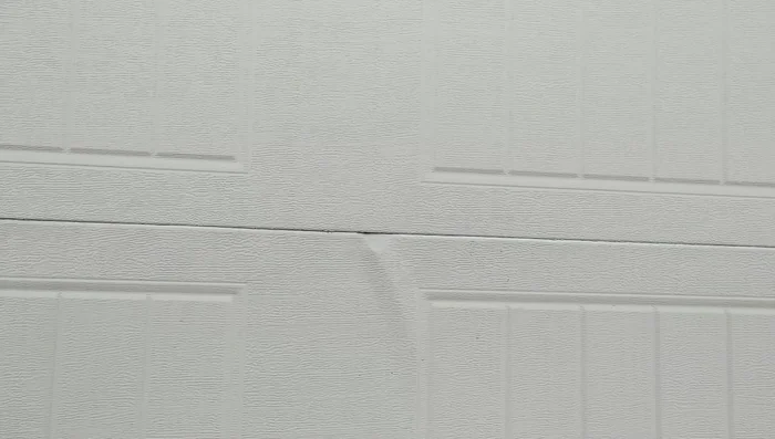 Address any remaining bulges or misalignments using a hammer and dowel rod.