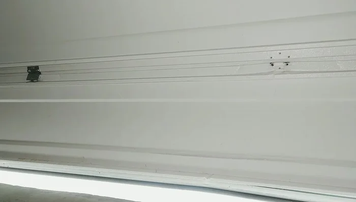 Test the garage door operation, addressing any sensor obstructions.