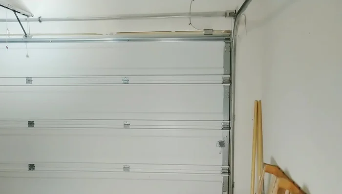 Test the garage door operation, addressing any sensor obstructions.