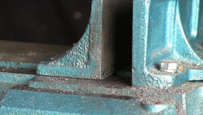 Weld a penny washer to the box section to create a housing for the threaded bar.