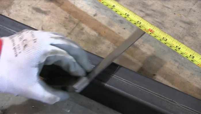 Weld a penny washer to the box section to create a housing for the threaded bar.