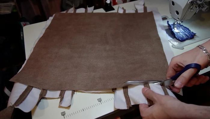 Sew back and forth on the ends of the zipper (optional).