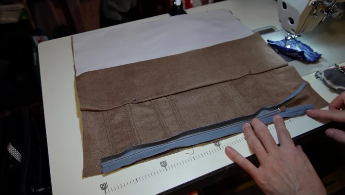 Sew back and forth on the ends of the zipper (optional).