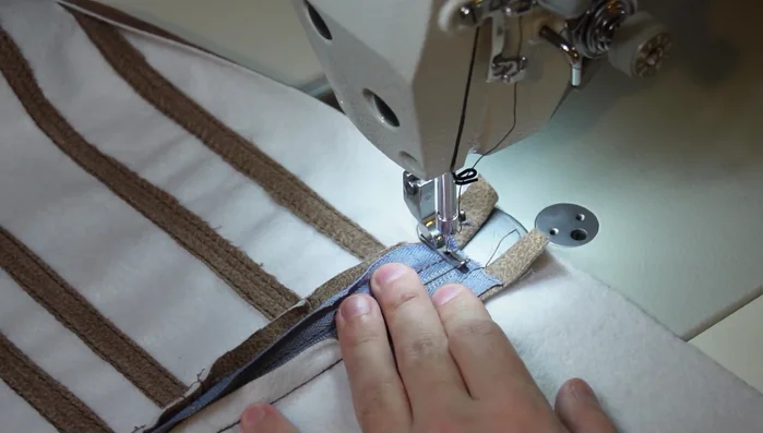Sew back and forth on the ends of the zipper (optional).