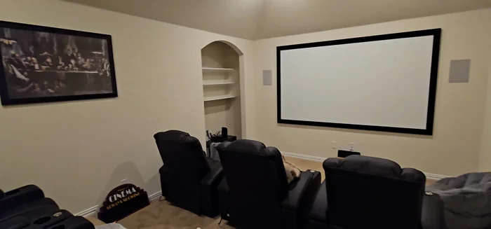 Arrange and place your new décor in your media room. This includes wall art and other decorative items.