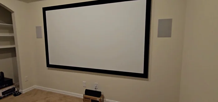 Set up your seating and entertainment system (TV, speakers, etc.).