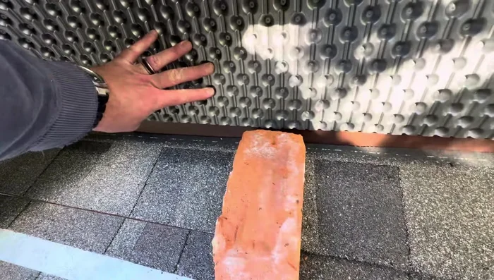 Install building wrap and siding over the flashing to complete the waterproofing.