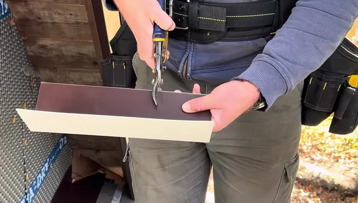 Install the final shingles over the peak flashing.