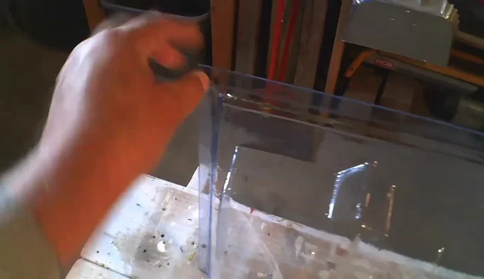 Attach the new window well cover using screws and cup washers for enhanced security.