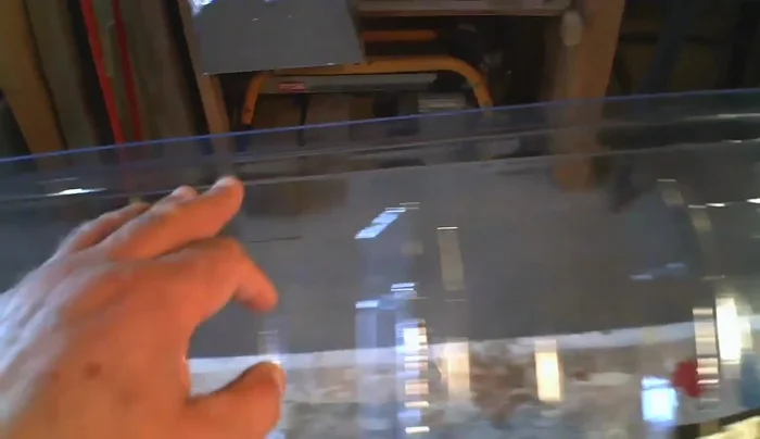 Attach the new window well cover using screws and cup washers for enhanced security.