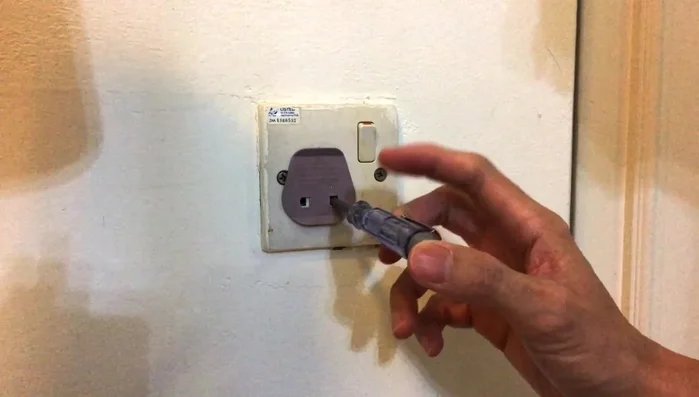 Retest the socket's live terminal with the test pen to confirm power is off.