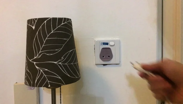 Test the new socket by plugging in a lamp and checking for consistent power.