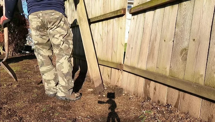 Remove any obstructions, such as tree roots, that might interfere with the new post's placement.