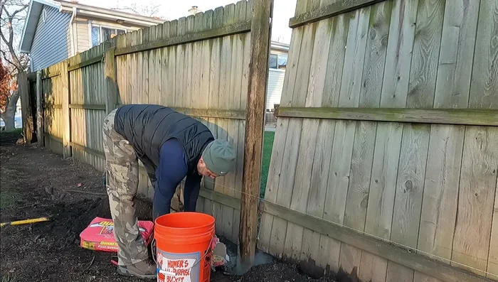 Ensure the post is level in both directions before the concrete sets.