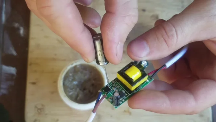 Solder the new capacitor in place.