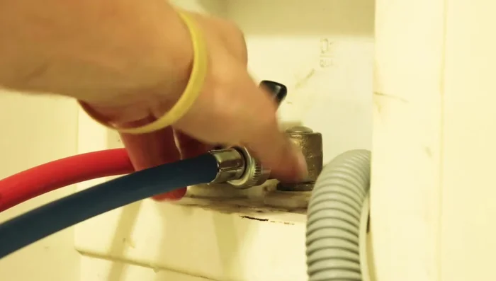 Tighten the hoses further using channel-lock pliers if necessary, ensuring they are snug (about a half-turn after snug).