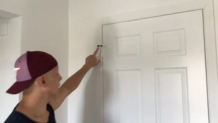 Once the pin is mostly out, use the claw end of the hammer to remove it completely.