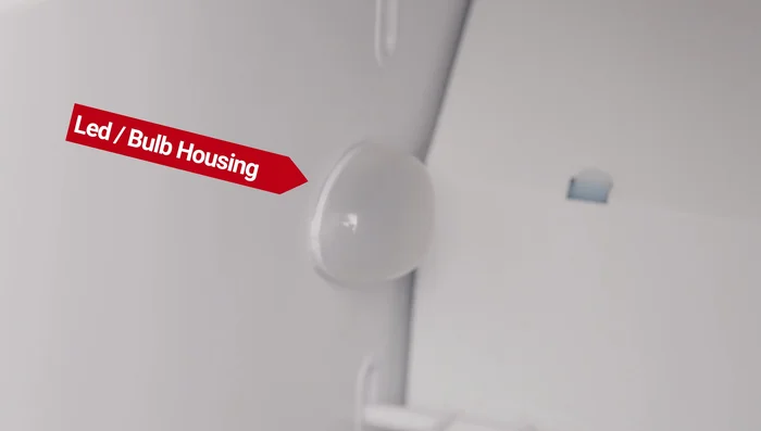 For some refrigerators, carefully remove the housing using a grip method to release internal and external clips. (Bear Grip Method demonstrated in the video)