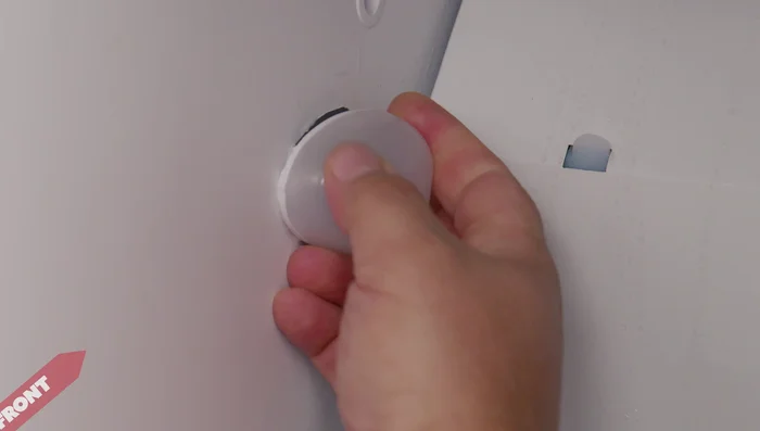 For some refrigerators, carefully remove the housing using a grip method to release internal and external clips. (Bear Grip Method demonstrated in the video)