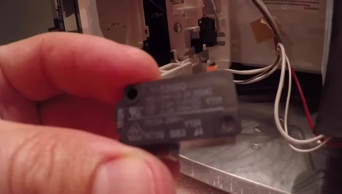 Install the new switch, ensuring proper orientation and connections.