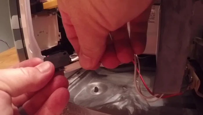 Install the new switch, ensuring proper orientation and connections.