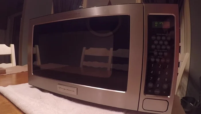 Plug in the microwave and test its functionality.
