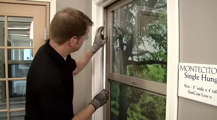 To reinstall, place the hook at the bottom of the balancer into the window jam and press down (it's spring-loaded, so expect resistance). Push the top portion up and ensure the tab goes on the outside of the balancer.