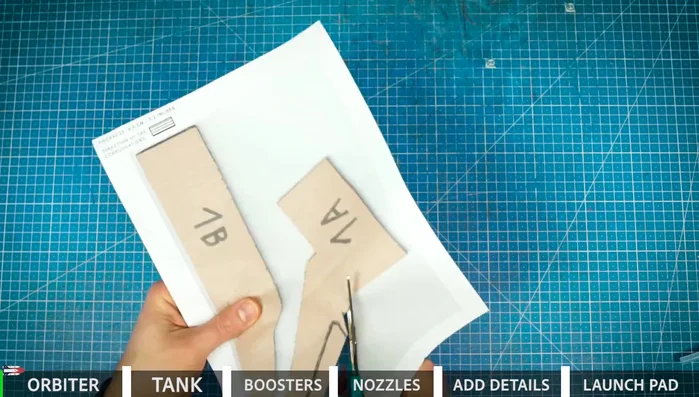 Prepare cardboard pieces for the shuttle body and wings.