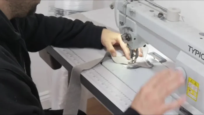 Join piping ends: Overlap the piping ends, and fold them back on themselves to create a neat join, then sew.