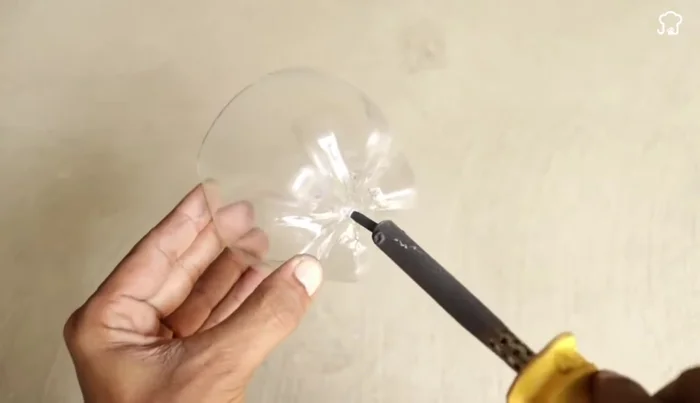 Prepare the rubber piece: Make a hole in the center of a circular rubber piece (using a soldering iron)