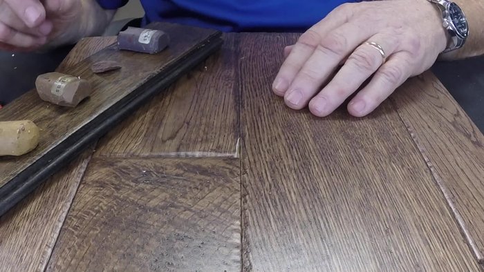 Heat the iron and apply the mixed wax to the chipped area.