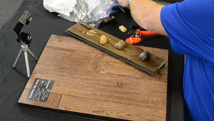 Heat the iron and apply the mixed wax to the chipped area.