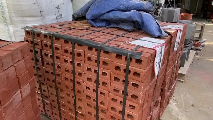 Create the arched opening: Use a plywood and 2x4 template for accurate brick cutting and placement.