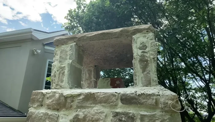 Install capstone: Place the capstone, which serves as a spark arrestor.