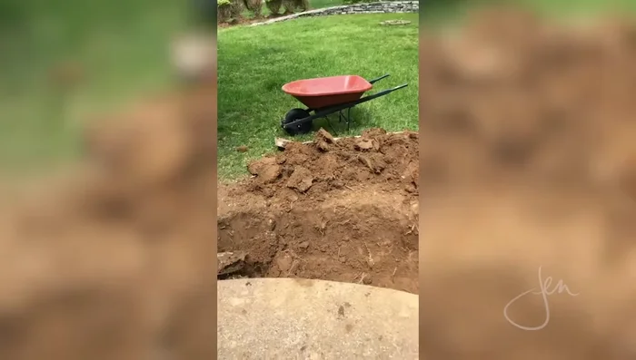 Prep the site: Dig up existing plants (boxwood bushes in this example) and check local building codes. Ensure no underground utility lines exist.