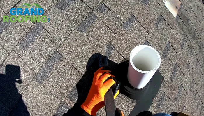 If necessary, cut the old shingles to remove the pipe boot completely. Avoid cutting into the drip groove.