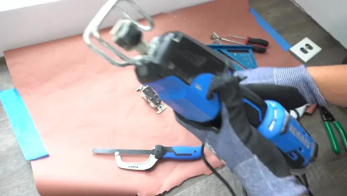 Use a Sawzall to carefully remove the old J-box. (Avoid using a hacksaw or prying, as this can damage the drywall.)