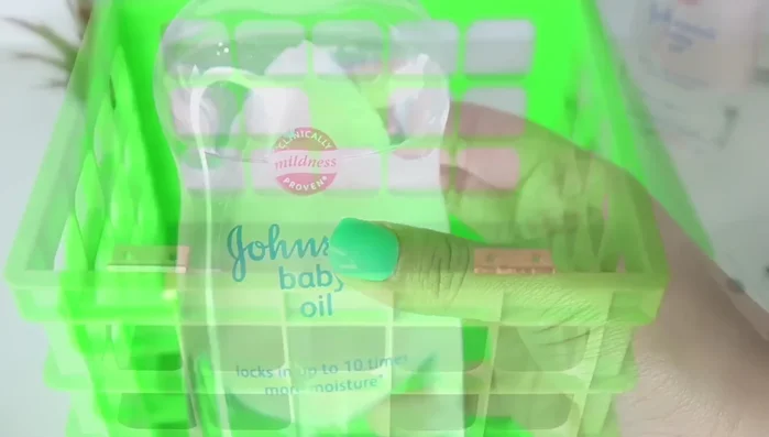 Attach frame to crate: Apply baby oil to prevent glue seepage. Add more E6000 to the frame's edge, position it on the crate, ensuring alignment of all sides.