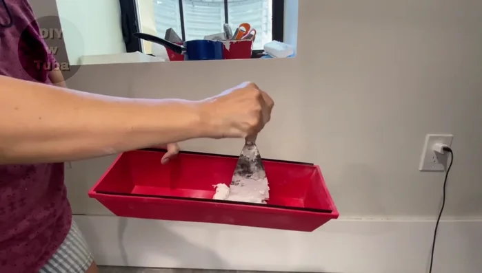 Sand the skim coat for a final, smooth finish.